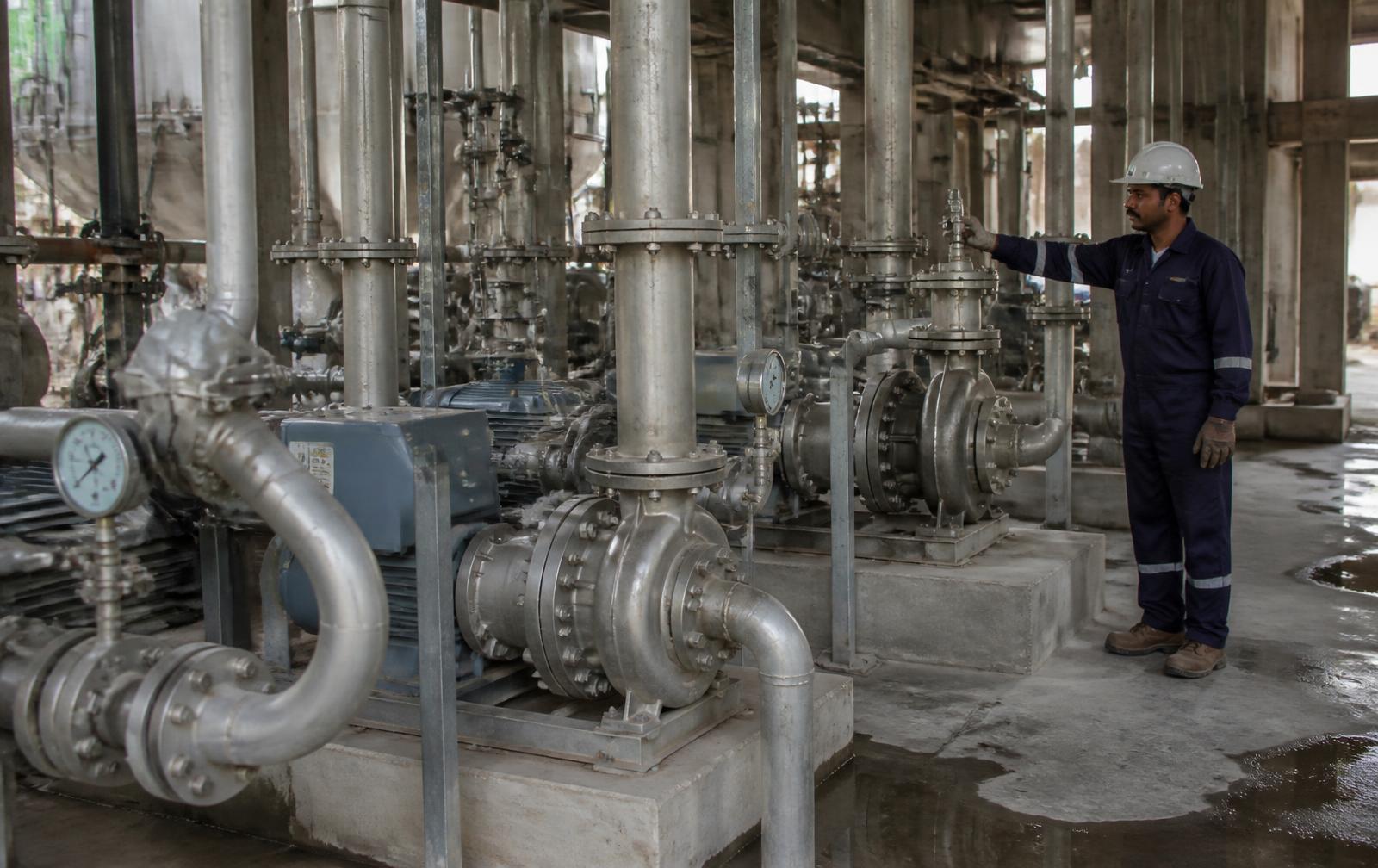 Stainless steel chemical process pumps in a plant pump house in Pakistan